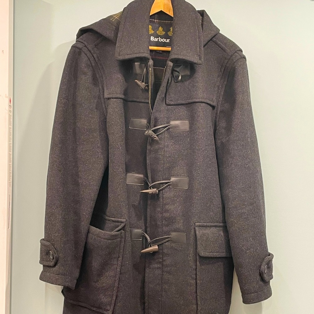 Never worn. Barbour jacket with hood.